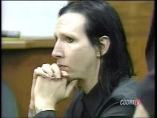 Marilyn manson appears in court with his hands folded without makeup 