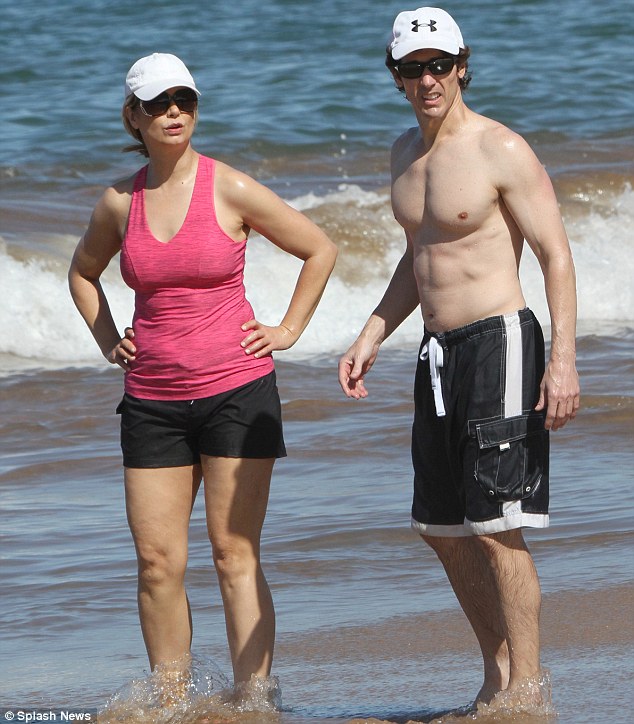 shirtless Joel Osteen with his wife