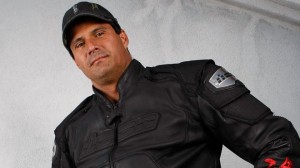 Jose Cansco poses in a black motorcycle jacket