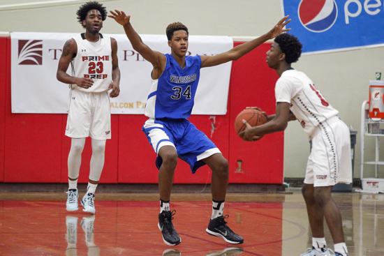 Shareef O'Neal, son of Shaquille O'Neal, basketball player for Windward High School, plays defense in game against Prime Prep.