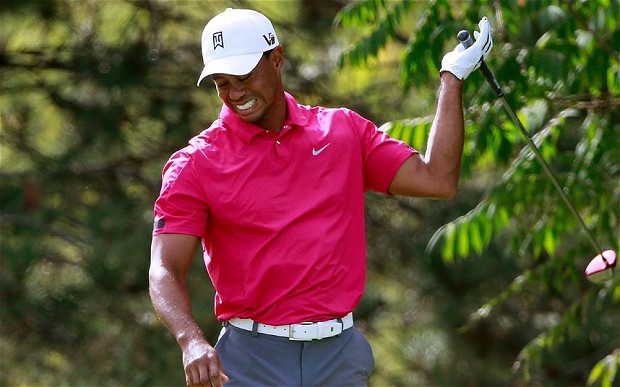 LAKE FOREST, IL - SEPTEMBER 14: Tiger Woods reacts on the 15th tee after hitting a shot into the water during the Third Round of the BMW Championship at Conway Farms Golf Club on September 14, 2013 in Lake Forest, Illinois. (Photo by Sam Greenwood/Getty Images)